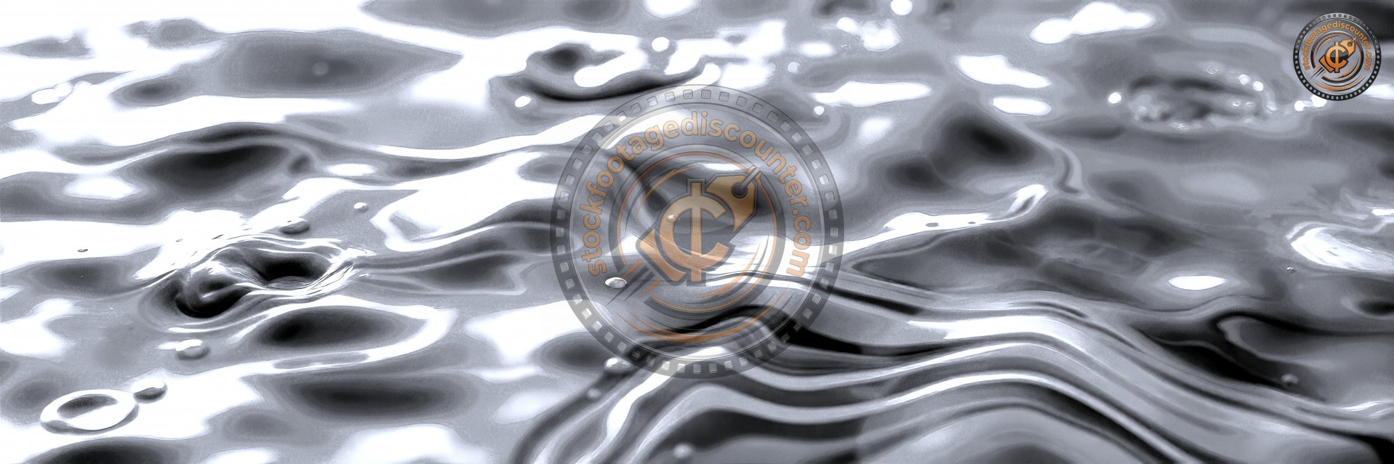 A   c l o s e - u p   o f   r i p p l i n g   b l u e   w a t e r   w i t h   a   f e w   s m a l l   b u b b l e s