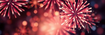 Colorful fireworks illuminate the night sky during a celebration in a vibrant display of lights and energy