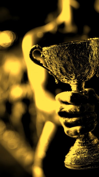 Sportswoman Raised Hand Holding Golden Sports Cup 3c4ac861 2045 4192 A210 39fcc6acbdad 1 Gigapixel Standard 6x Gold