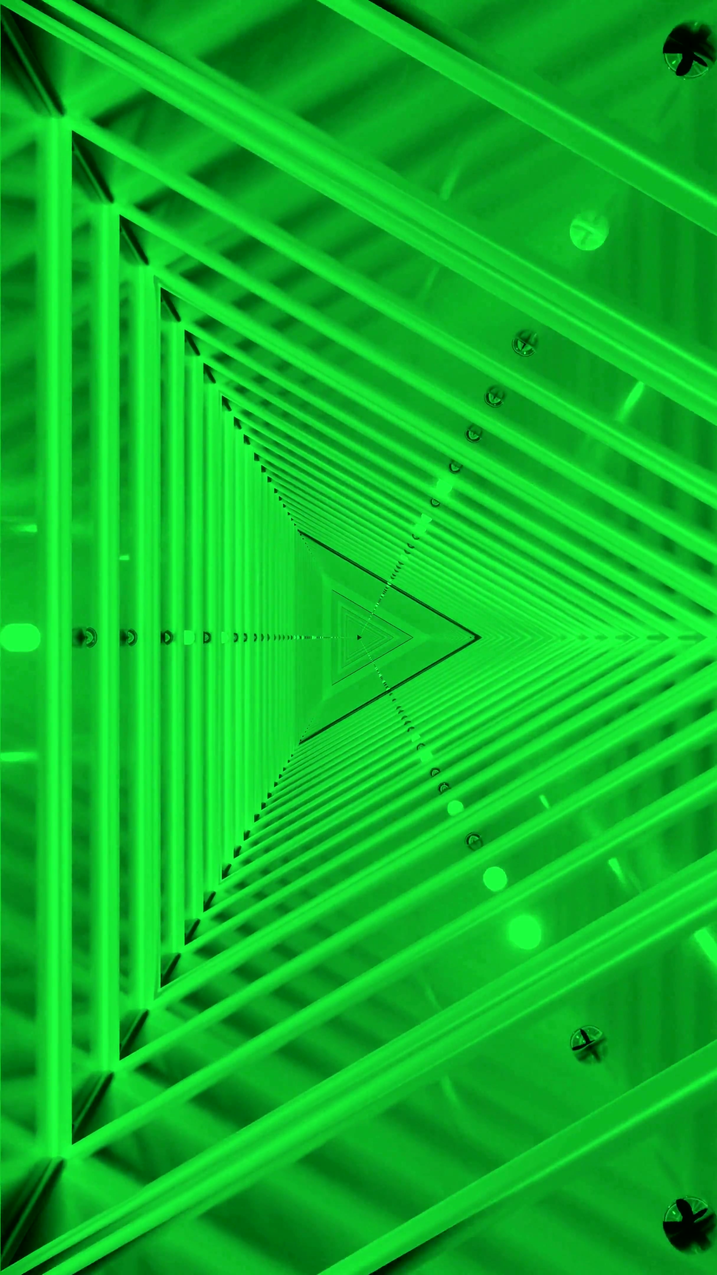 Seamless loop of a green tunnel filled with light patterns moving