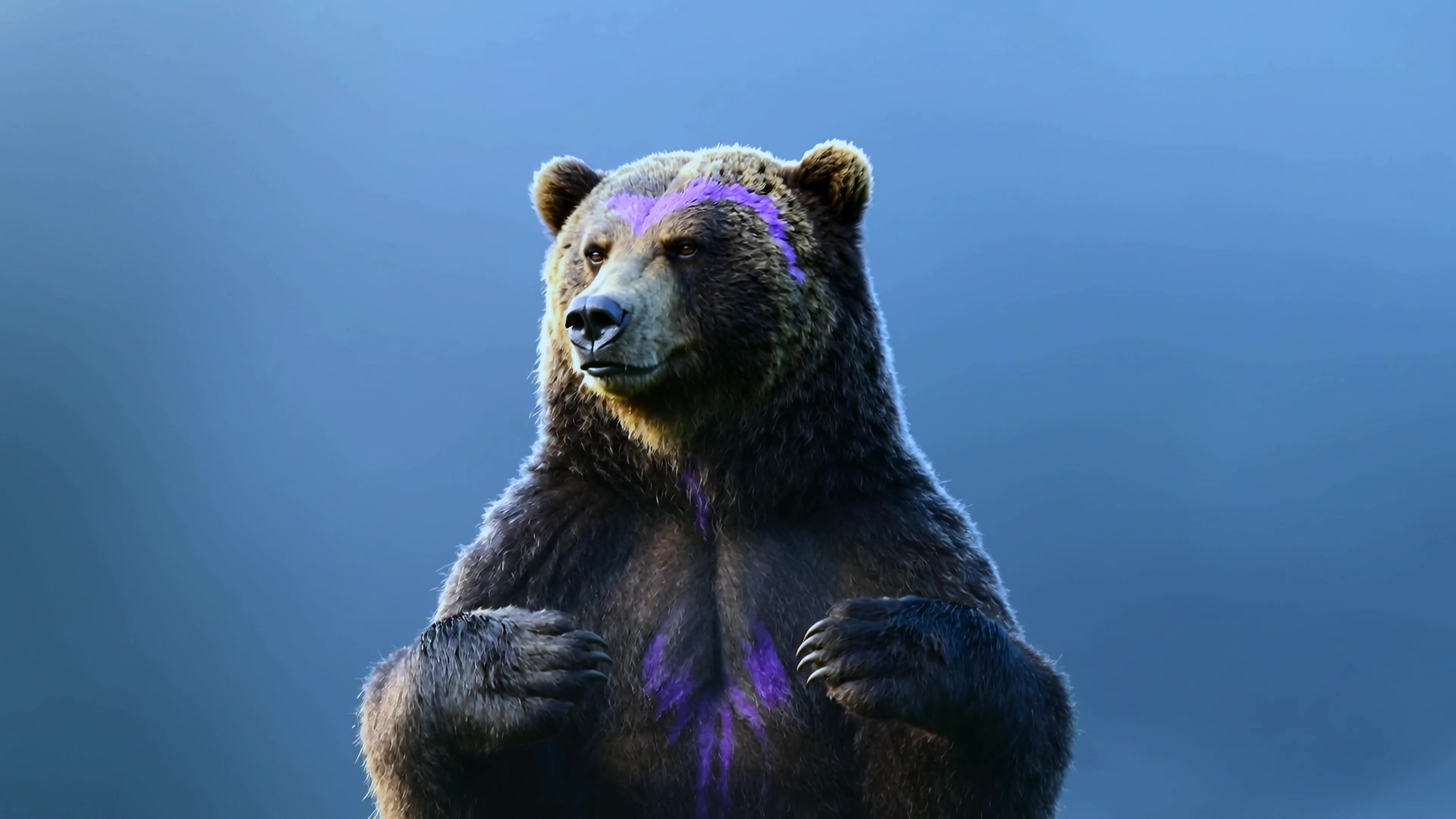 Bear with purple markings stands on its hind legs in a forest setting during daylight