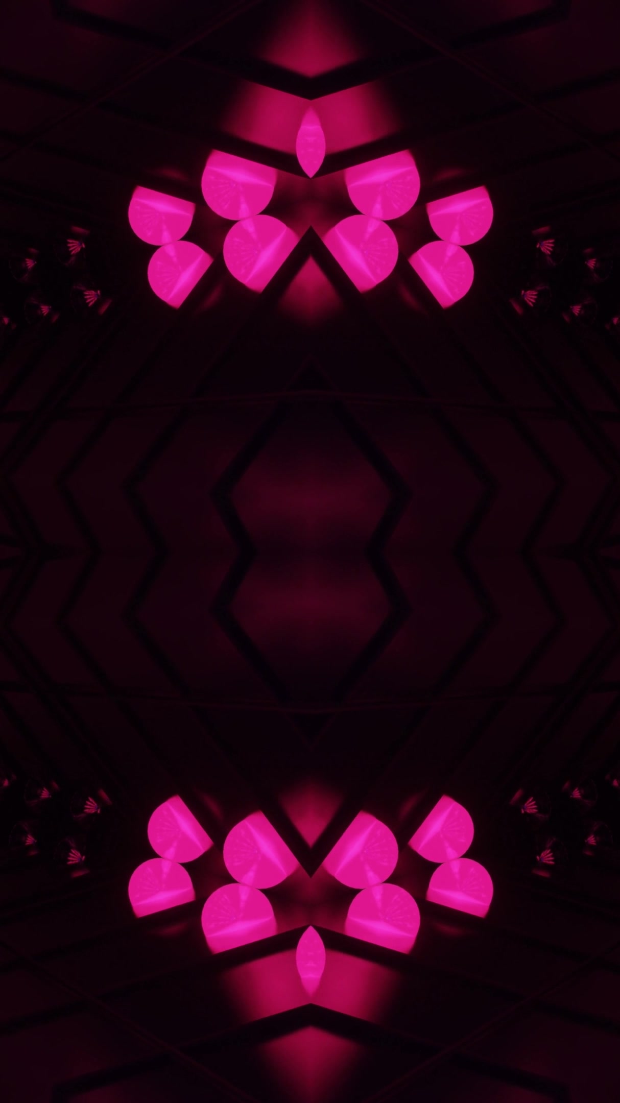 Seamless tunnel vj loop screensaver creates a mesmerizing visual experience with vibrant pink patterns