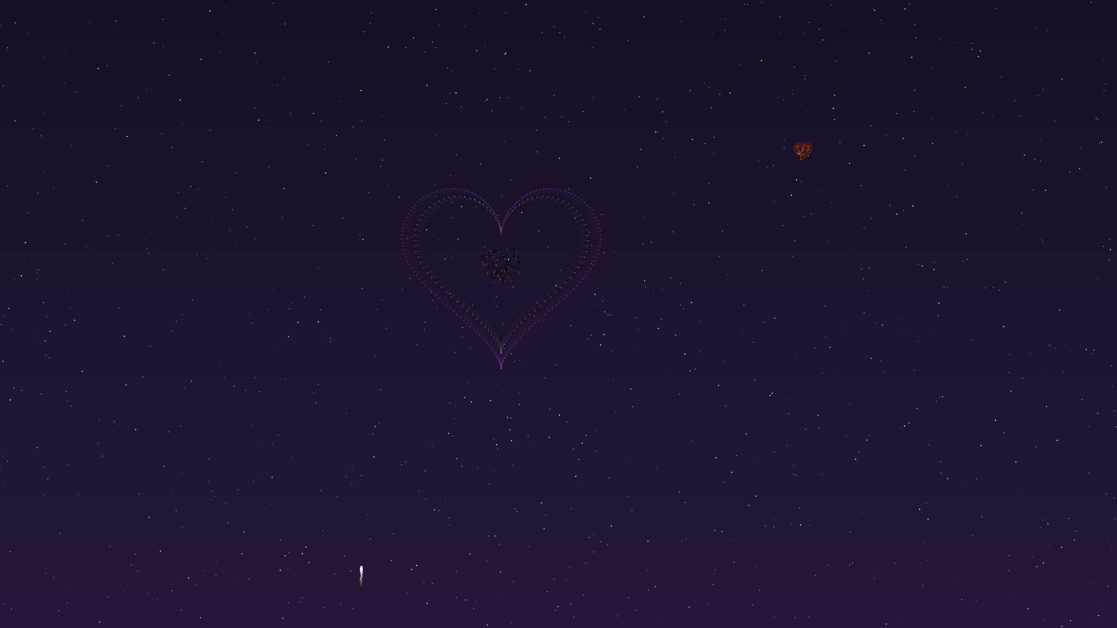 Valentines day fireworks display with heart shapes lighting up the dark night sky during a romantic celebration