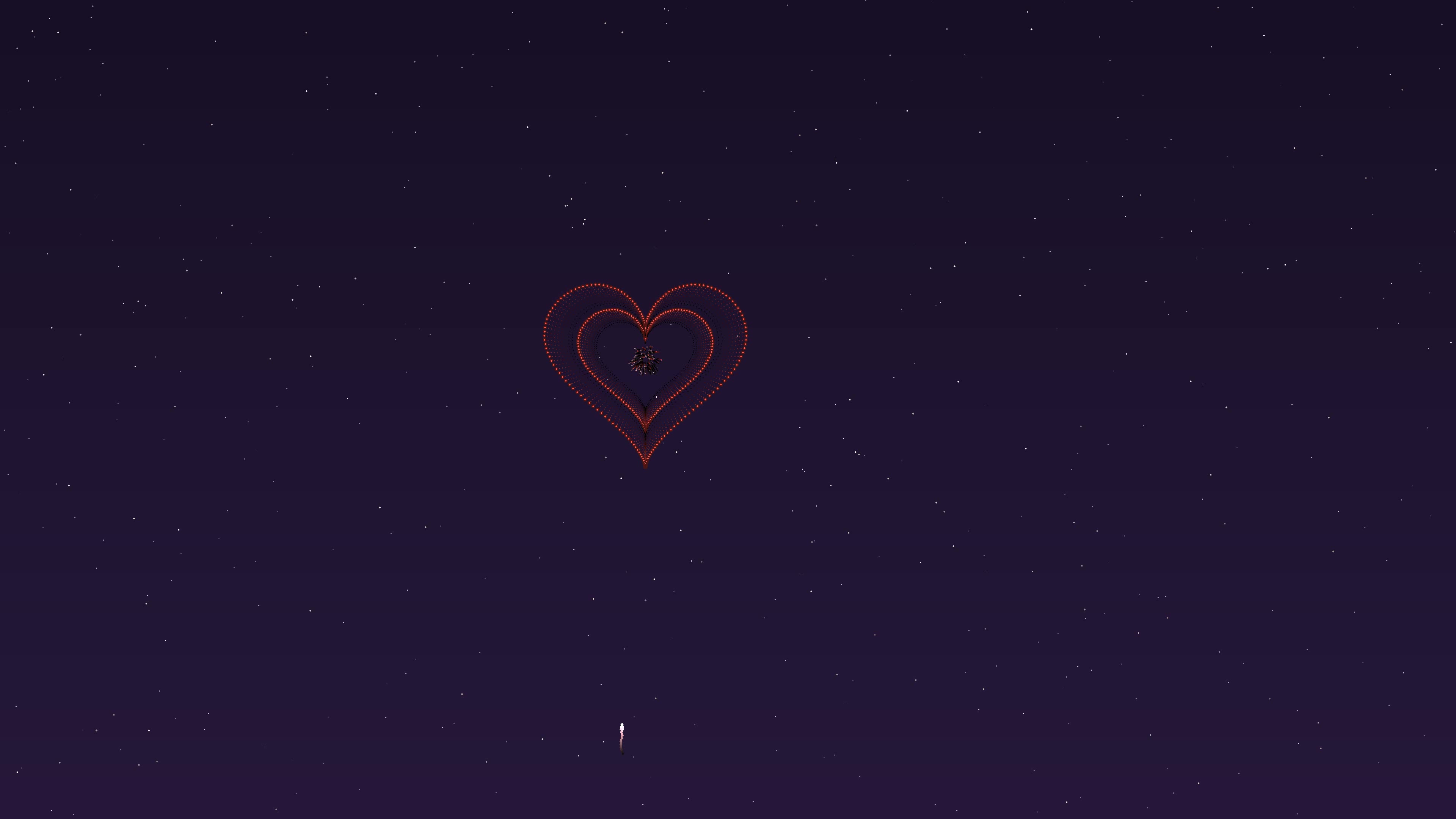 Valentines day fireworks with hearts exploding in the night sky over a celebration event