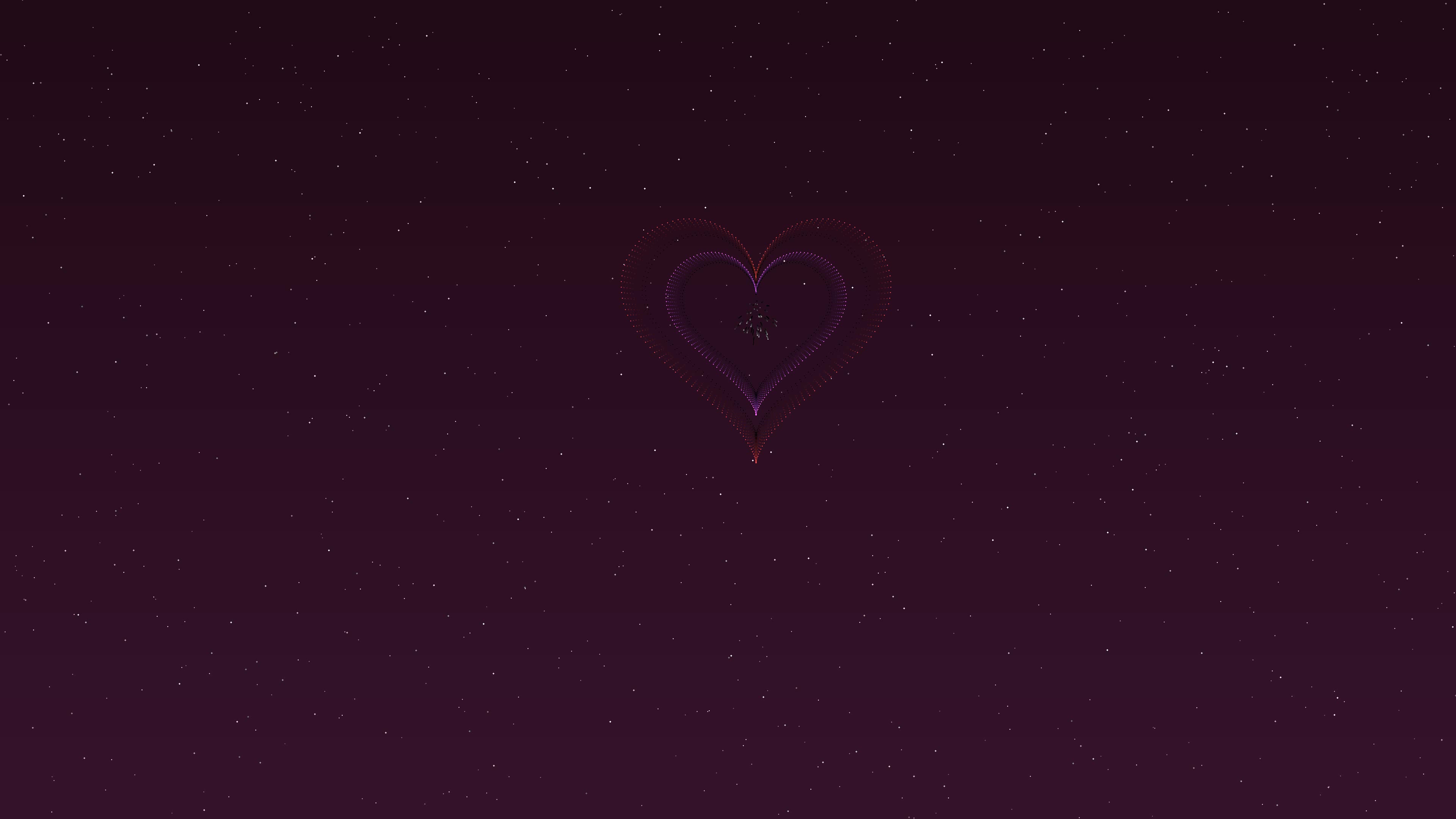 Colorful fireworks light up the night sky with heart shapes for a special celebration on Valentines Day